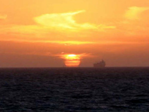 A ship headed into Perth at sunset on the Indian Ocean. (Photo by Mark Craemer)
